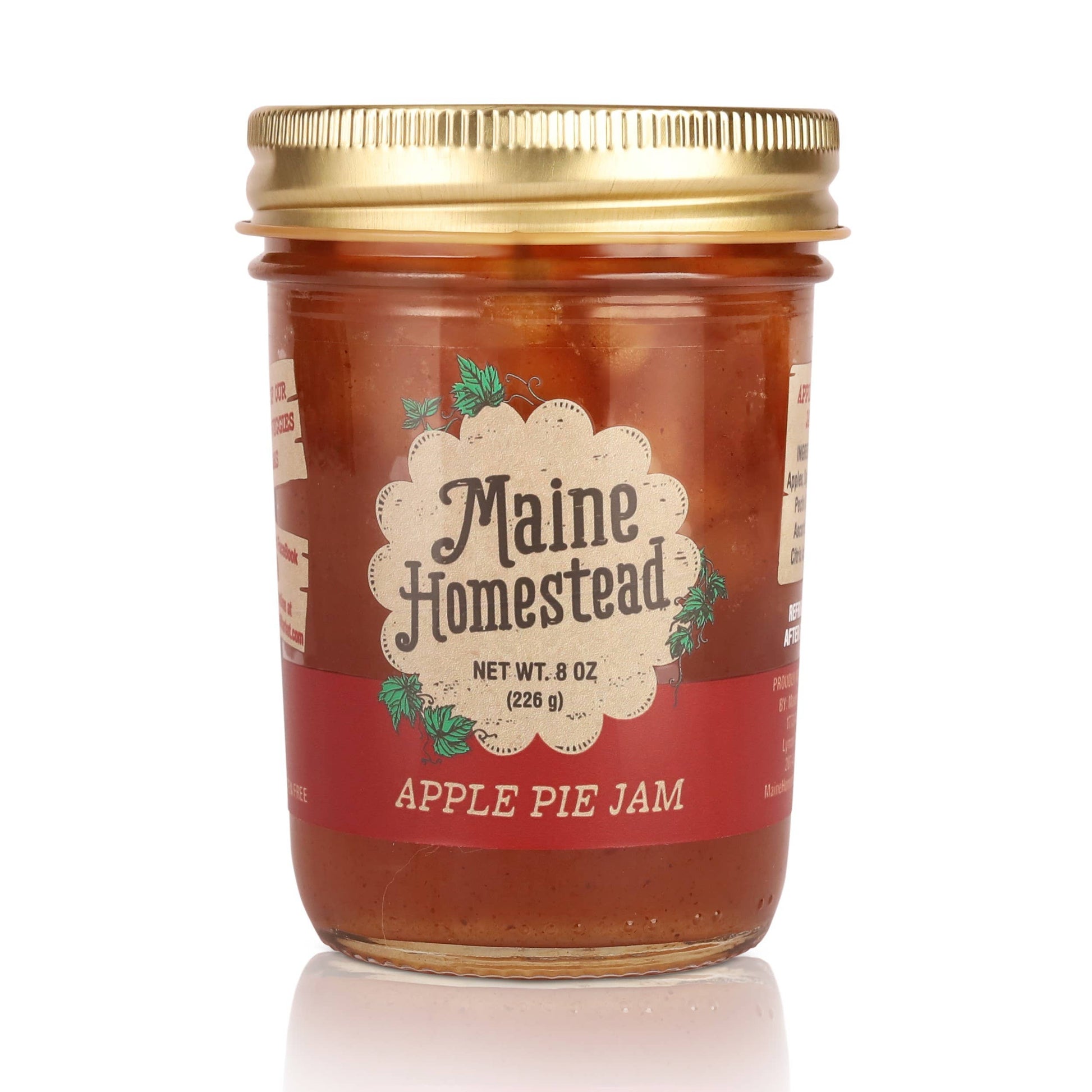 Jar of Maine Homestead Apple Pie Jam with a gold lid on a white background