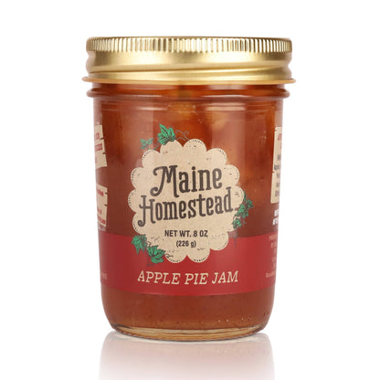 Jar of Maine Homestead Apple Pie Jam with a gold lid on a white background