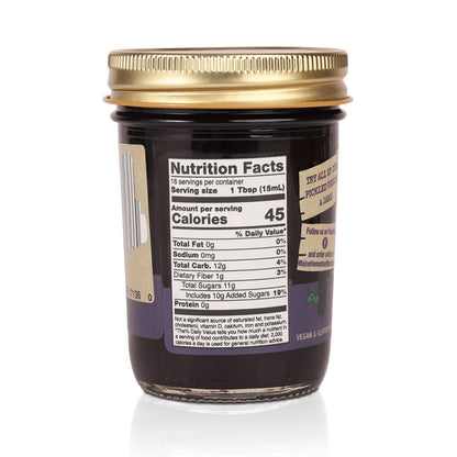 Jar with a gold lid and nutrition label on a white background