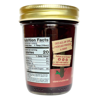 A glass jar of Maintenta's Organic Pickled Vegetables & Jams with a gold metal lid, showing the Nutrition Facts label and product branding on a white background.