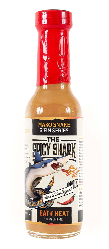 Hot sauce bottle with red cap and label featuring 'The Spicy Shark' branding on a white background.