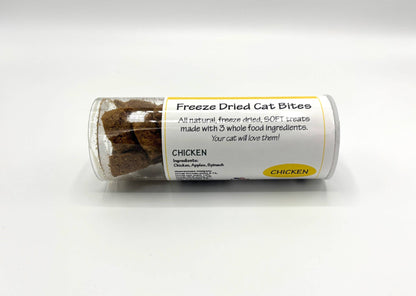 A clear plastic tube of Freeze Dried Cat Bites treats, labeled 'CHICKEN', lying horizontally on a white background.