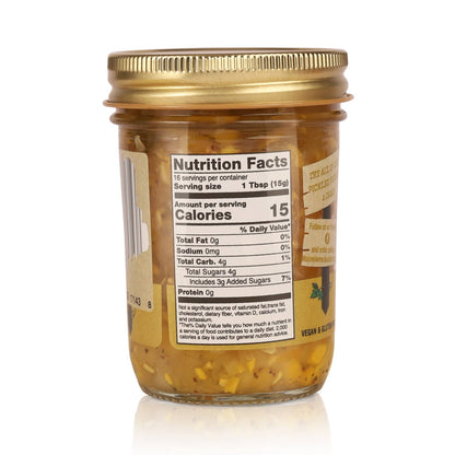 A glass jar of Veggie & Butter spread with a gold metal lid, showing the front nutrition facts label and side branding on a white background.