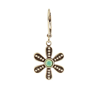 Gold flower-shaped earring with a green gemstone on a white background