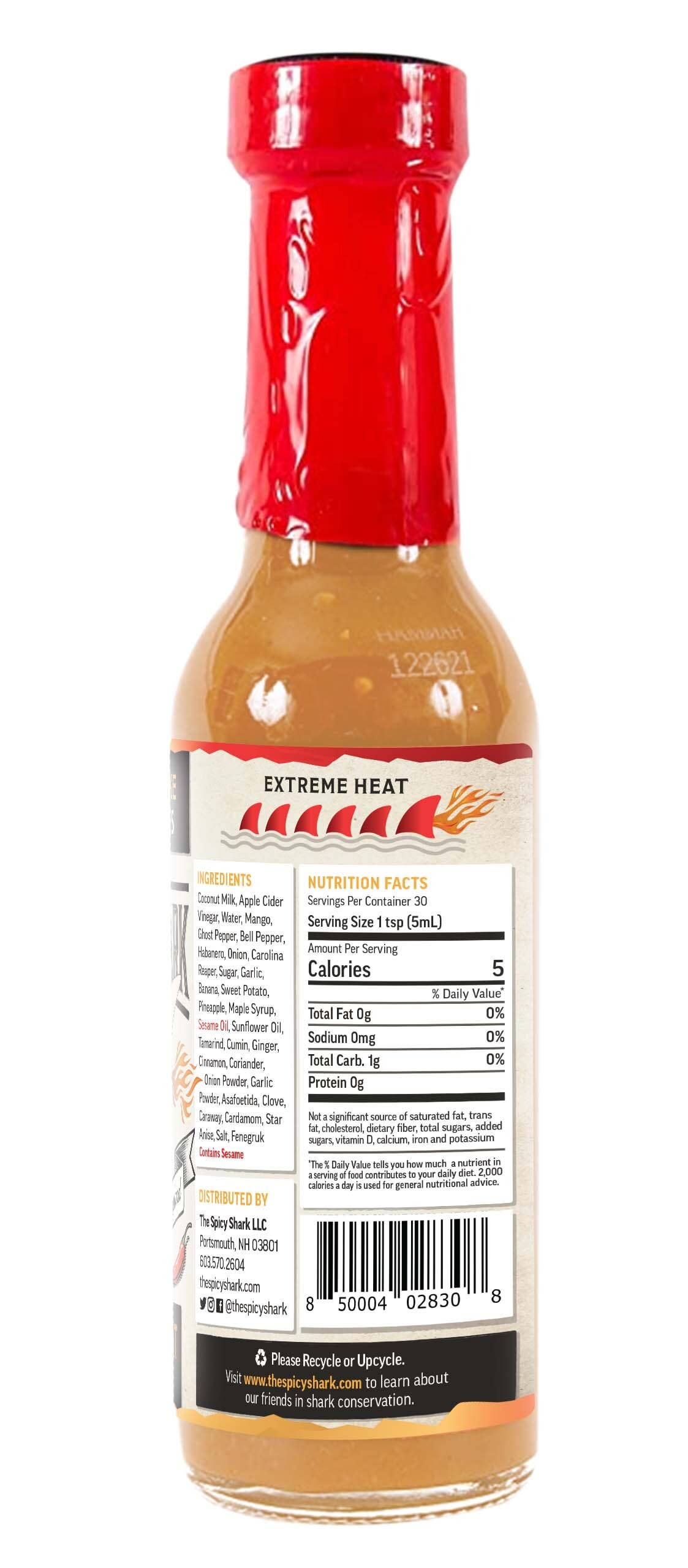 Hot sauce bottle with red cap and visible label on a white background