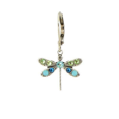 Dragonfly-shaped earring with gemstones on a white background