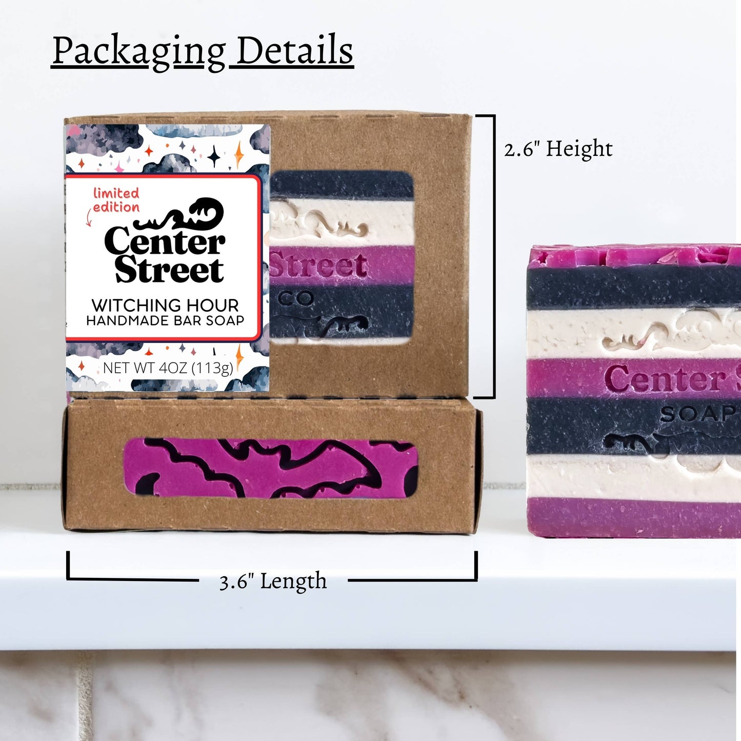 Packaging details for Center Street Soaps 'Witching Hour' handmade bar soap, showing a kraft paper box with a clear window displaying the striped soap bar and a branded product card, with dimension lines indicating 2.6" height and 3.