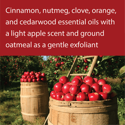 A promotional graphic with a red banner at the top containing text about essential oils and apple scent, above a photo of red apples in wooden barrels in an orchard.