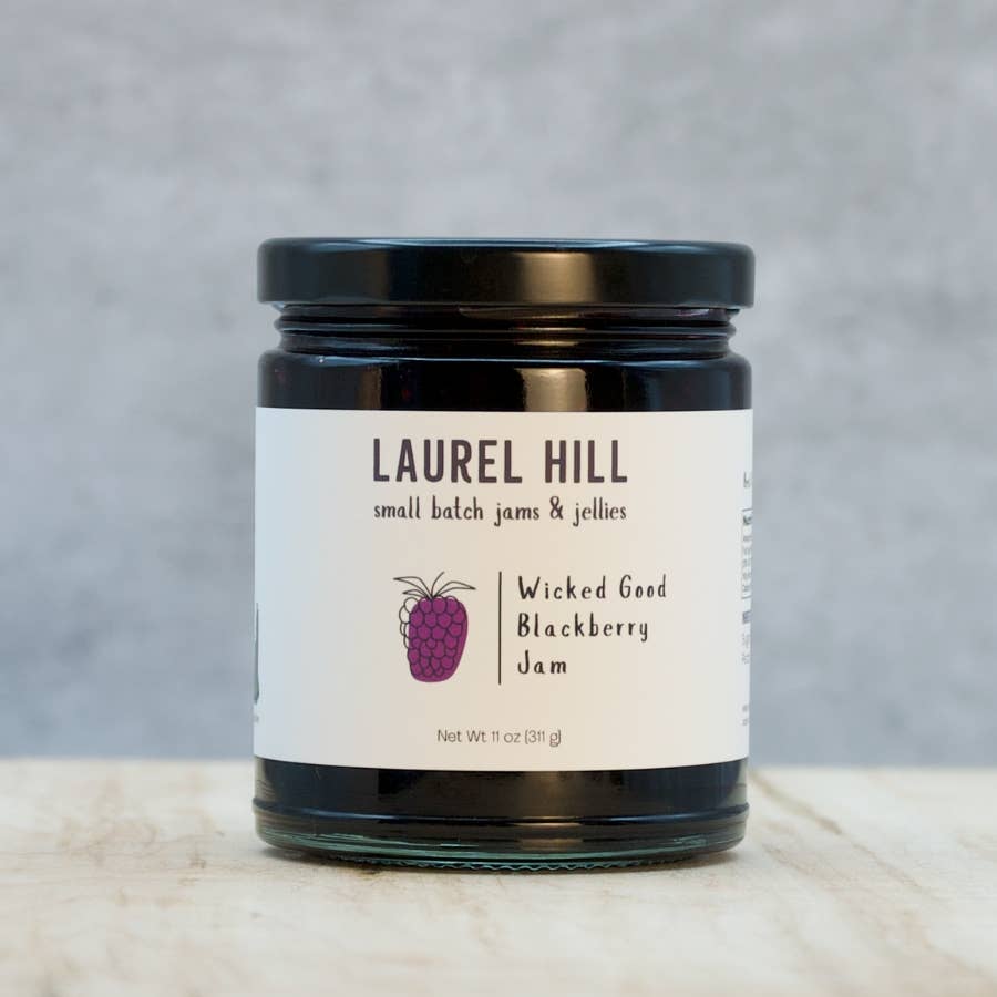 Jar of Laurel Hill Wicked Good Blackberry Jam on a neutral background