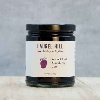 Jar of Laurel Hill Wicked Good Blackberry Jam on a neutral background