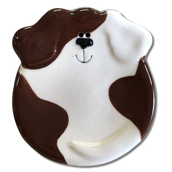 Dog-shaped ceramic plate with brown and white design on a white background