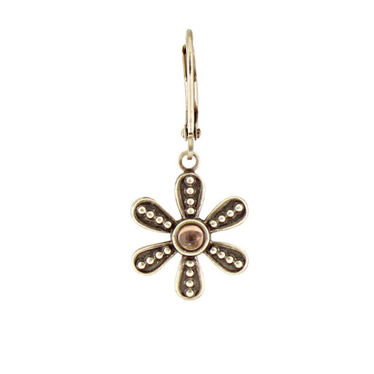 Gold flower-shaped earring on a white background