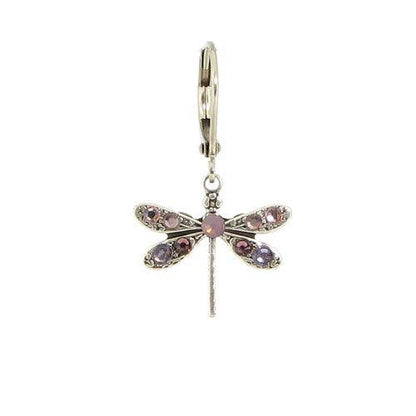 Dragonfly-shaped earring with pink gemstones on a white background