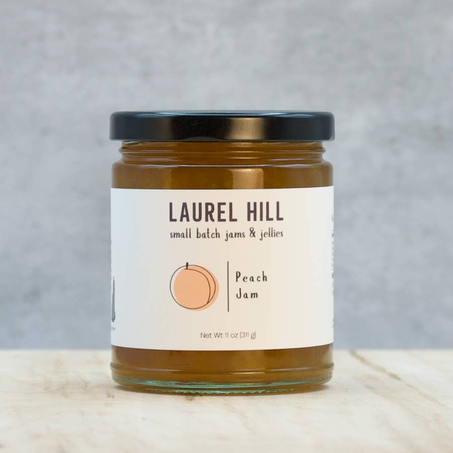 Jar of Laurel Hill peach jam on a gray background