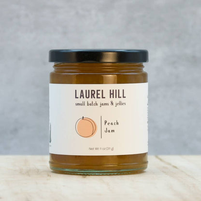 Jar of Laurel Hill peach jam on a gray background