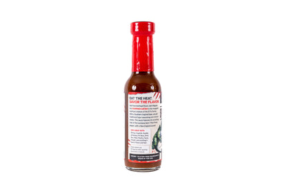 A bottle of hot sauce with a red cap and a white label that reads 'SAY THE HEAT, SAVOR THE FLAVORS' on a plain white background.