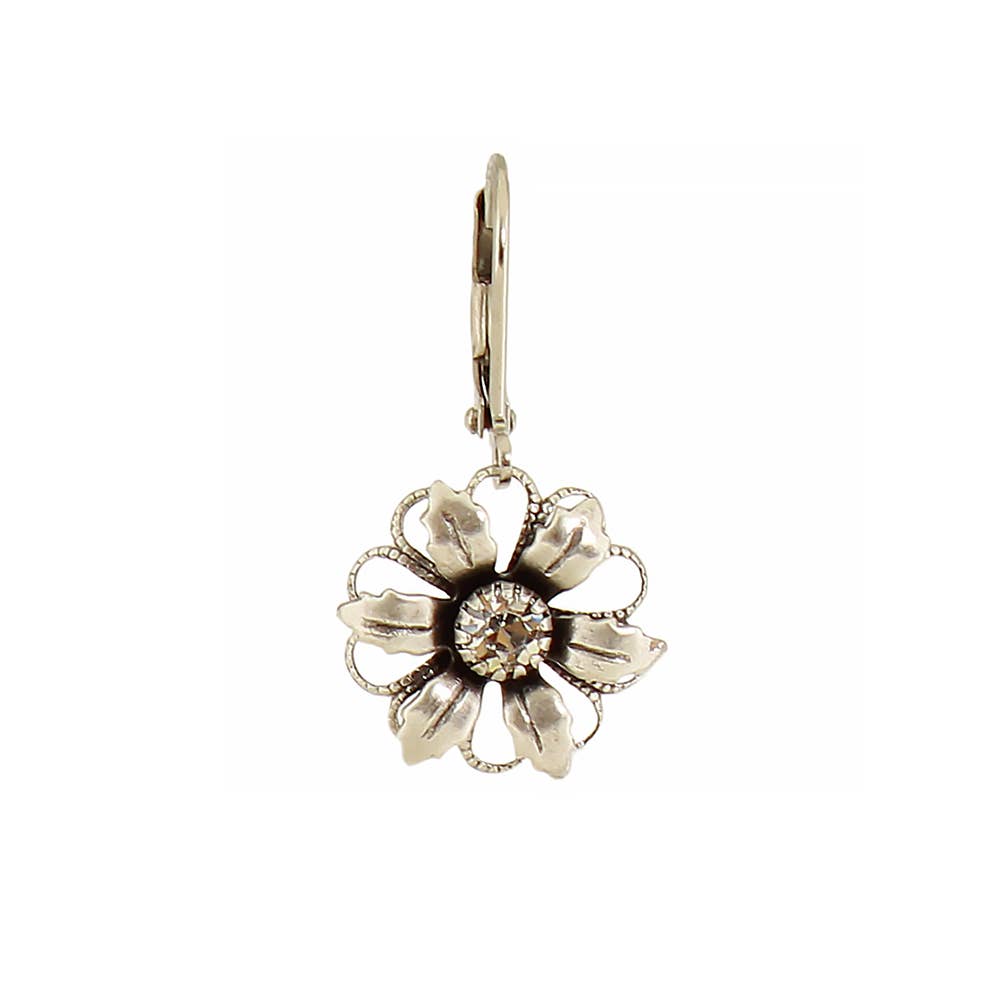 Floral silver earring on a white background