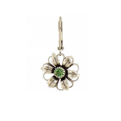 Floral earring with a green gemstone on a white background