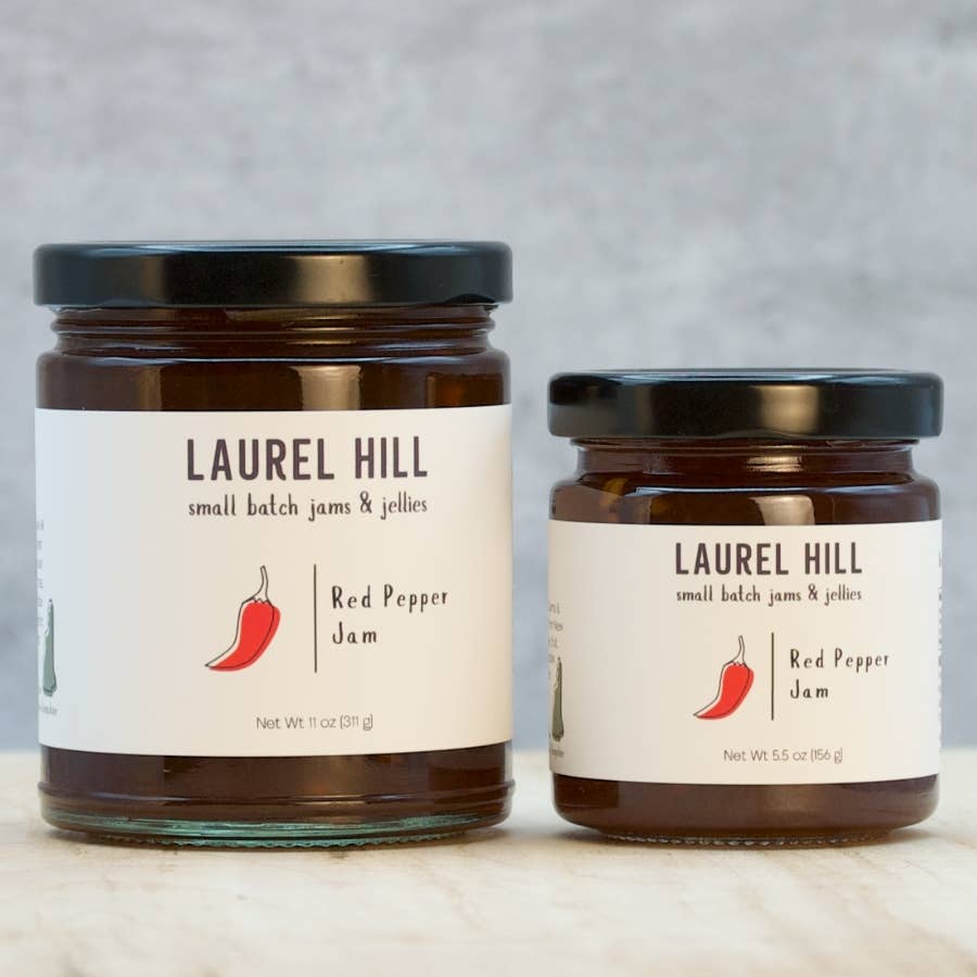 Two jars of Laurel Hill Red Pepper Jam on a neutral background