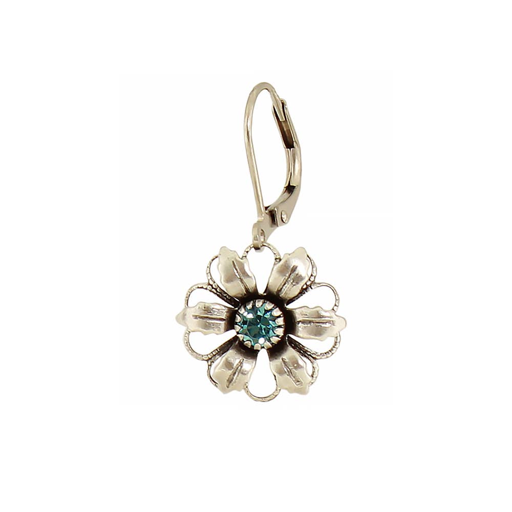 Silver flower-shaped earring with a blue gemstone on a white background