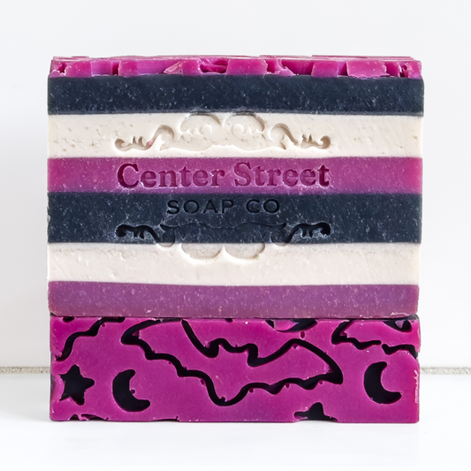 Bar of soap with layered colors and 'Center Street Soap Co' branding on a white background