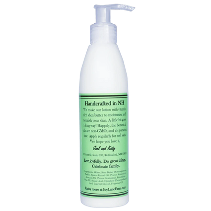 White lotion bottle with green label on a white background