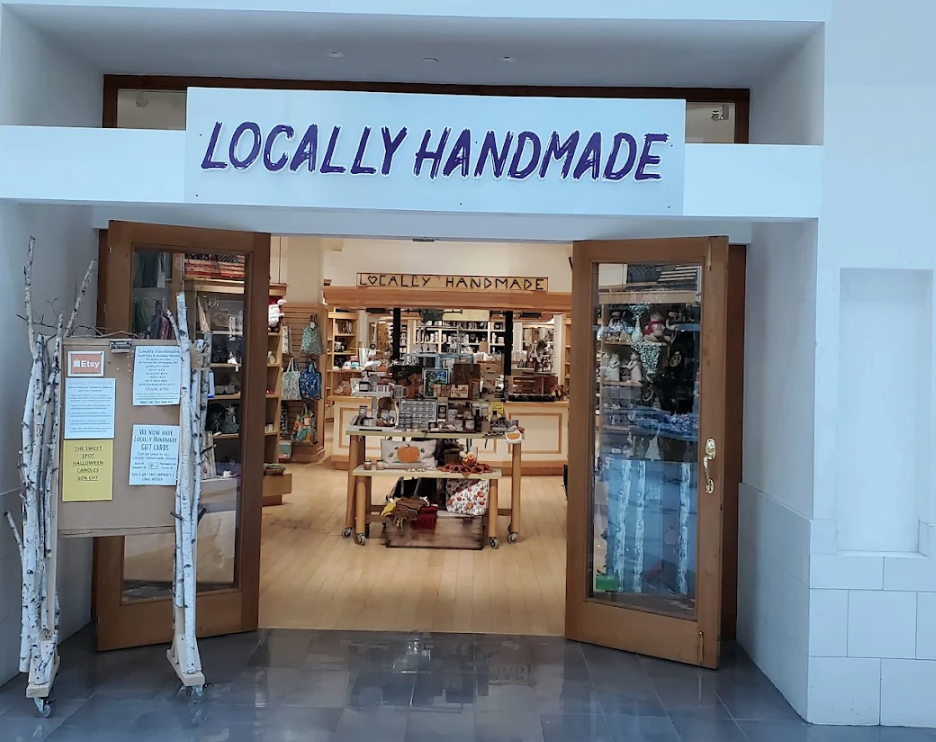 Storefront with 'Locally Handmade' sign above entrance