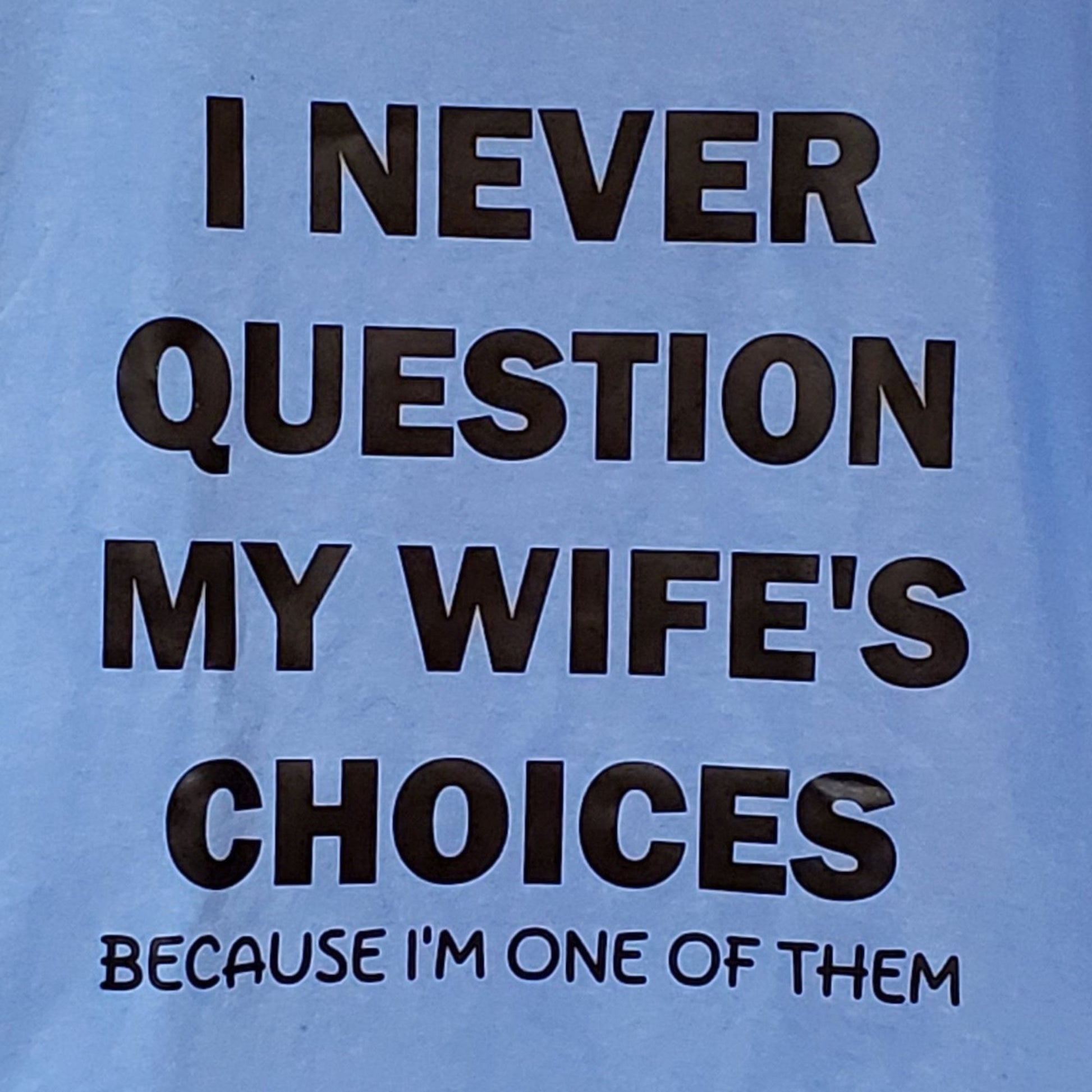 Blue t-shirt with black text on a blue background