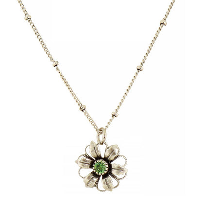 A silver-tone flower pendant necklace with a central green gemstone, displayed on a clean white background.