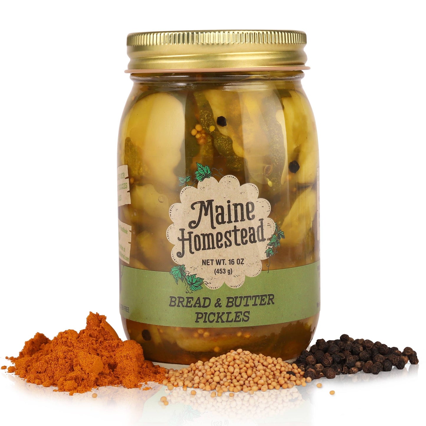 Jar of Maine Homestead bread and butter pickles with spices on a white background