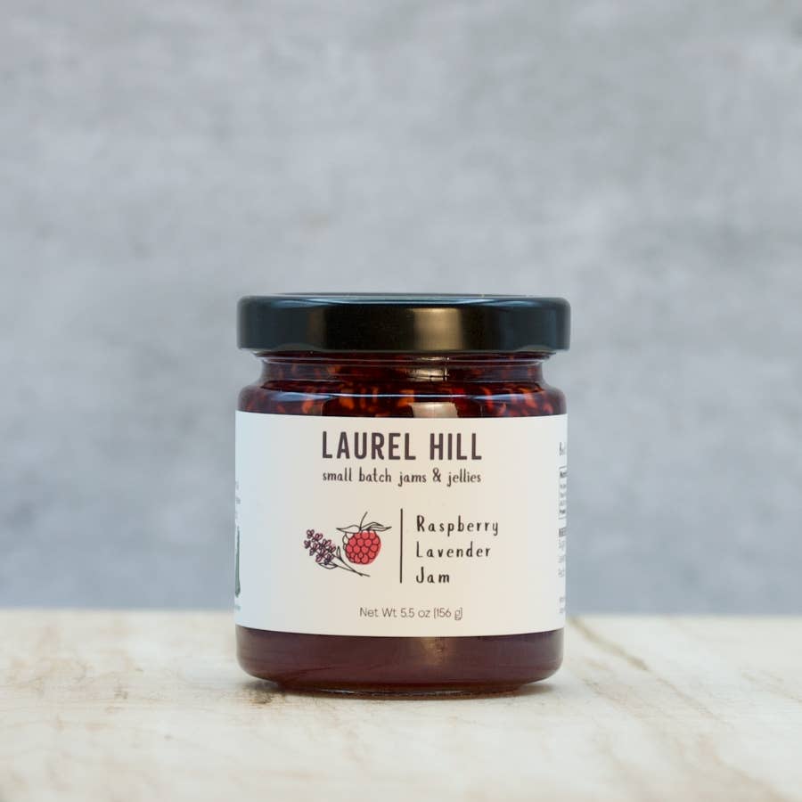 Jar of Laurel Hill raspberry lavender jam on a neutral background