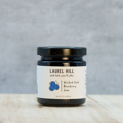 Jar of Laurel Hill Wicked Good Blueberry Jam on a neutral background