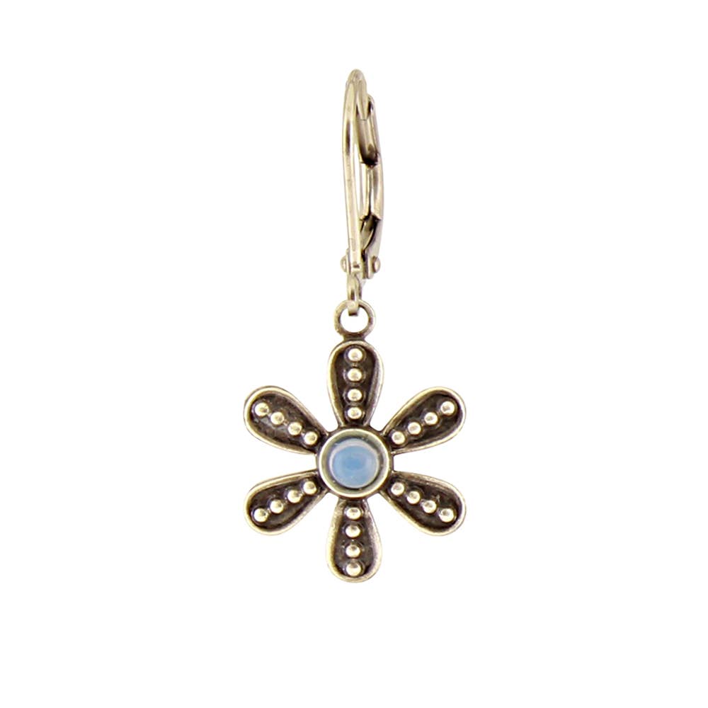 Gold flower-shaped earring with a central blue gemstone on a white background