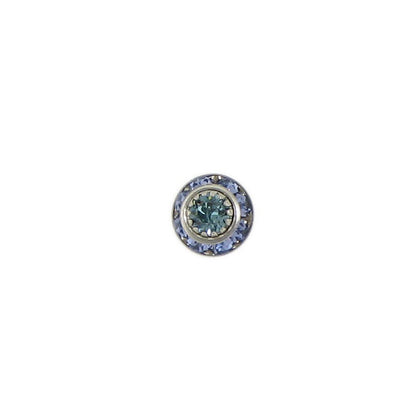 A single round stud earring featuring a central light blue-green gemstone surrounded by a halo of small blue stones in a silver-toned setting, isolated on a solid white background.