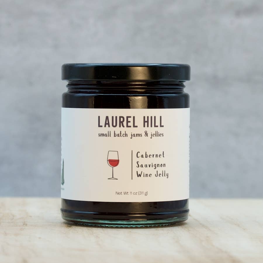 Jar of Laurel Hill Cabernet Sauvignon wine jelly on a neutral background