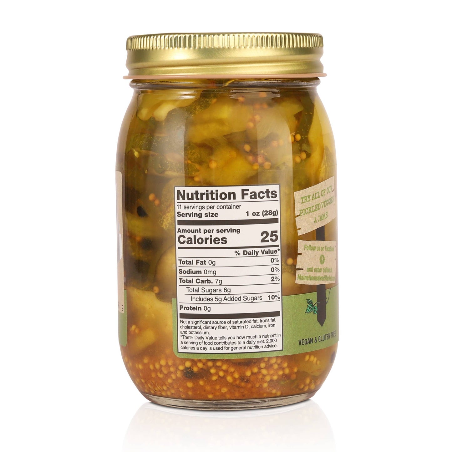 Jar of pickles with a gold lid and nutrition facts label on a white background
