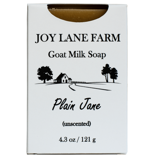 A white rectangular box of Joy Lane Farm Goat Milk Soap, Plain Jane, unscented, with black text and a small farm illustration on the front.