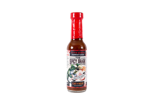 A bottle of Shaw'n Gatorz 'The Spicy Shark' hot sauce on a solid white background.