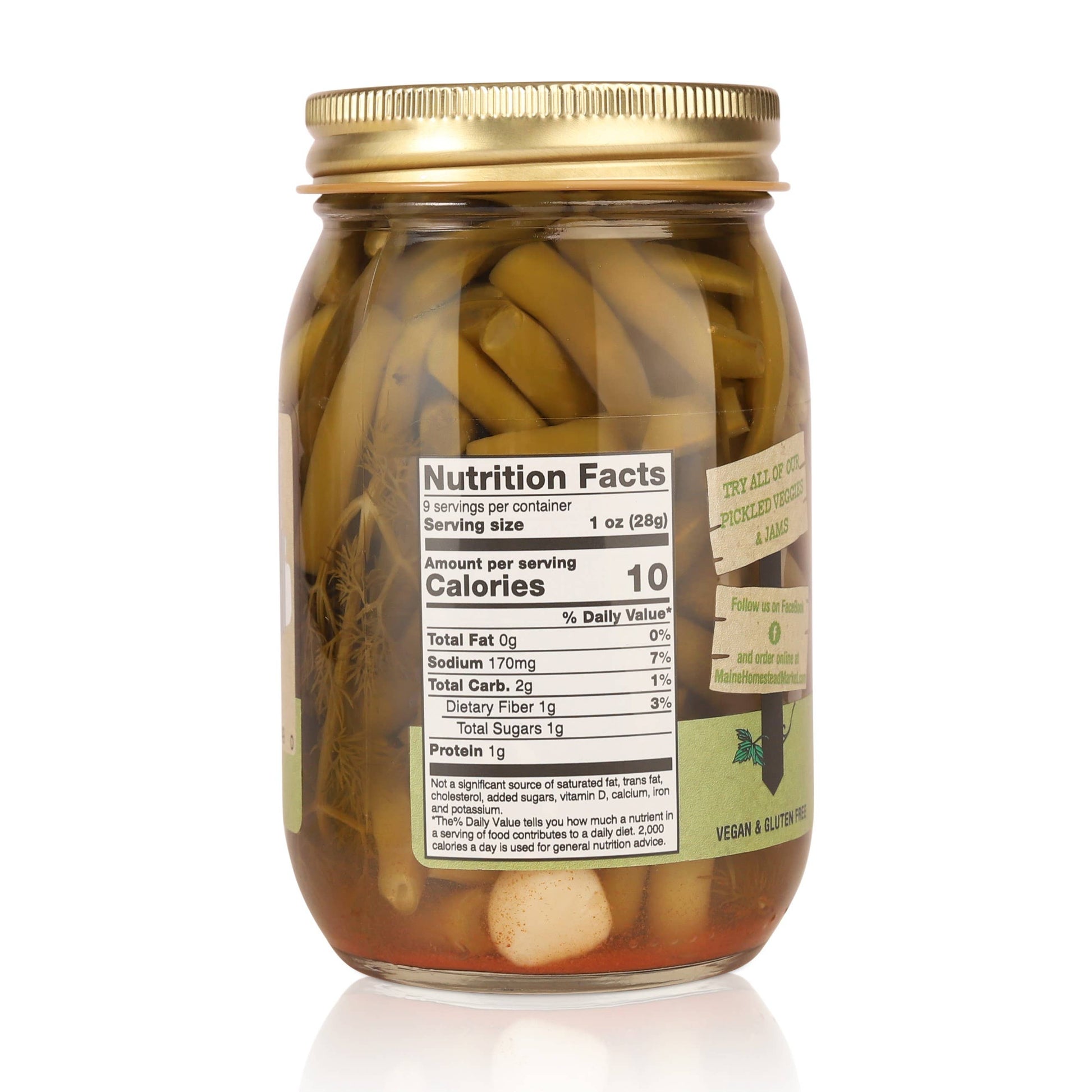 A glass jar of vegan and gluten-free pickled onions with a gold metal lid, featuring a prominent white nutrition facts label on the front, set against a plain white background.