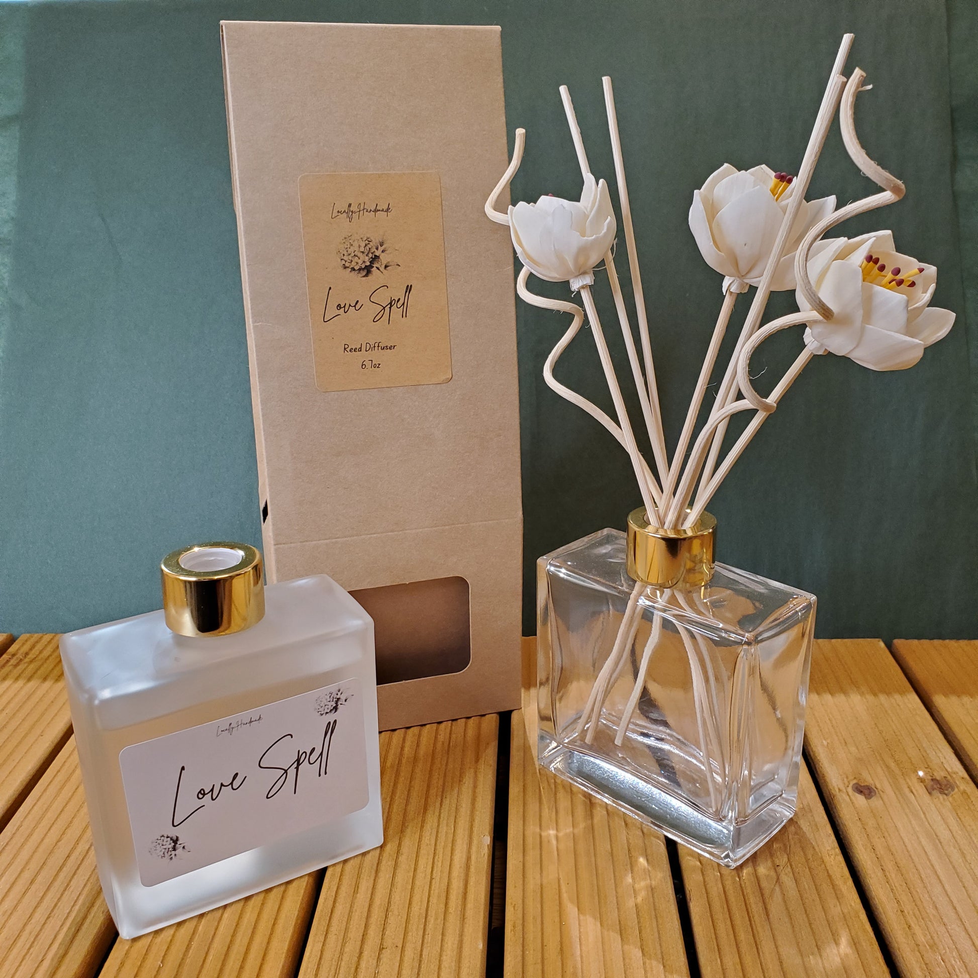 Decorative diffuser with floral design on a wooden surface