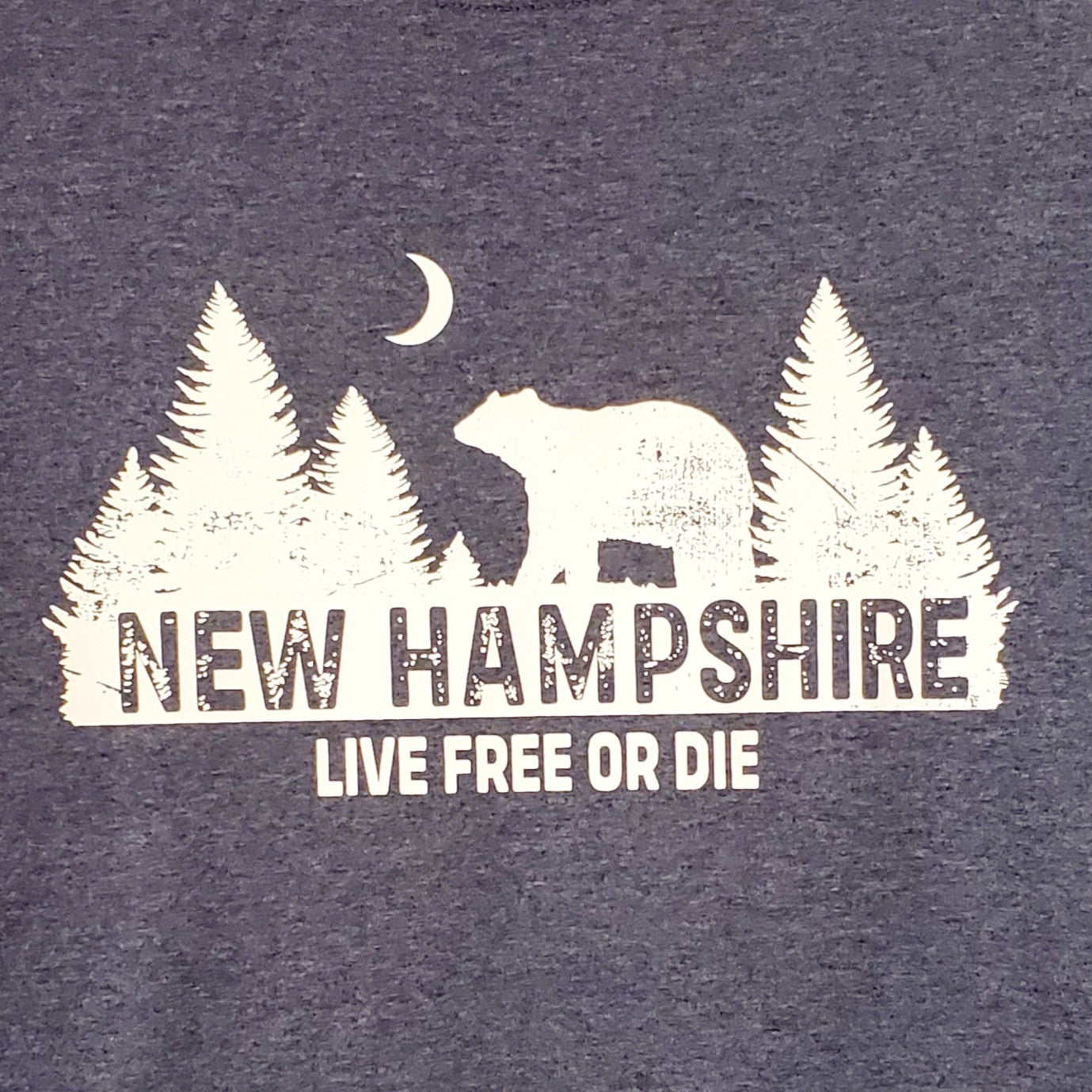 Navy blue shirt with white bear and tree design and 'New Hampshire Live Free or Die' text.
